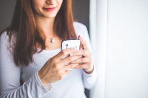 Woman receiving text message